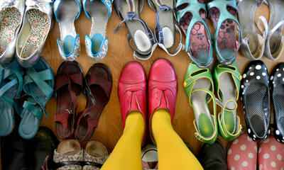 assortment of shoes person standing in pair in middle
